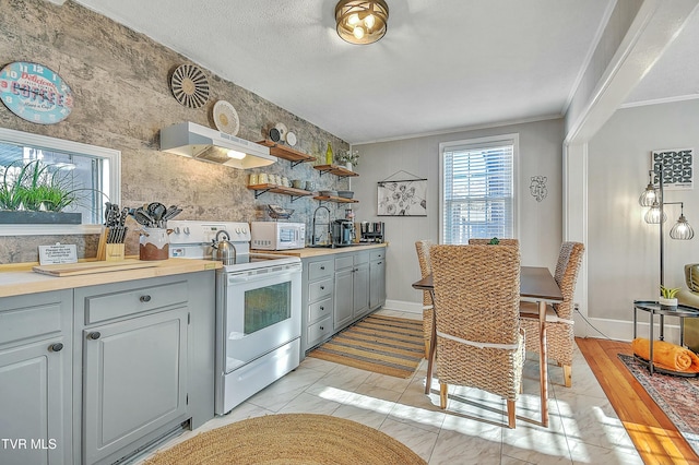 kitchen with gray cabinets, sink, ornamental molding, white appliances, and a textured ceiling