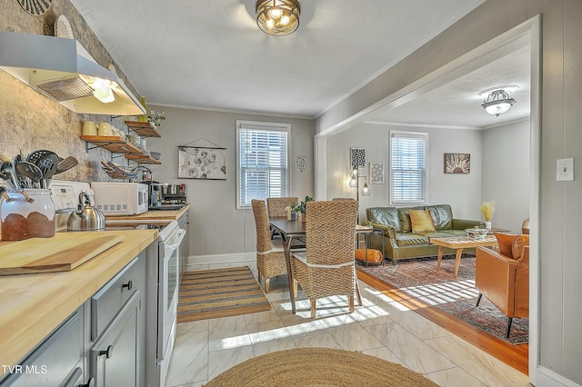 kitchen with wood counters, ventilation hood, a textured ceiling, ornamental molding, and white appliances