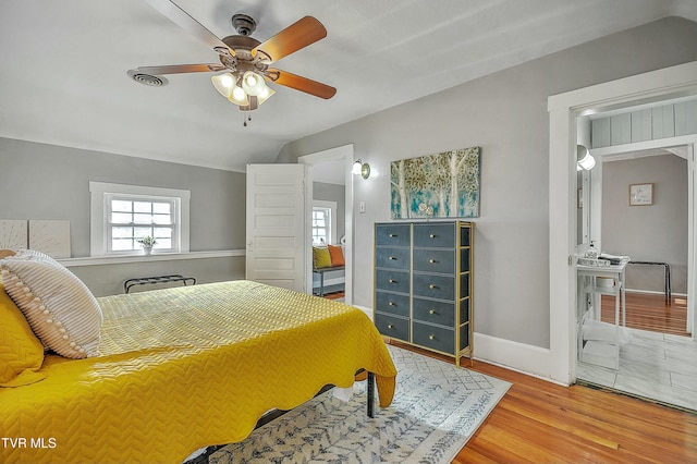 bedroom with hardwood / wood-style flooring and ceiling fan