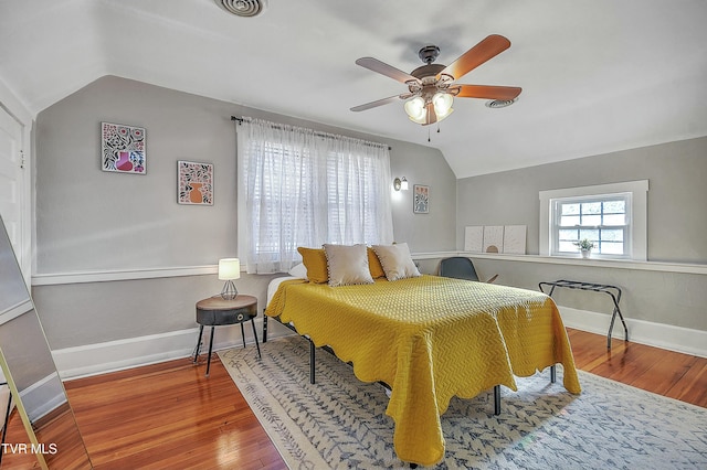 bedroom featuring ceiling fan, lofted ceiling, and wood-type flooring