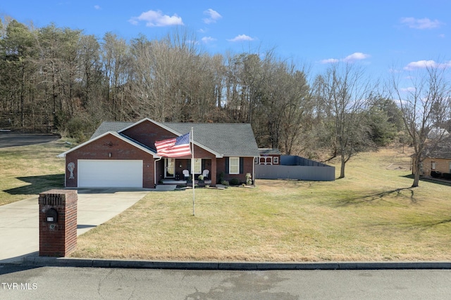 view of front of home with a garage and a front yard