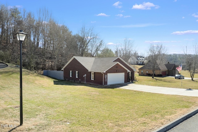 view of front of home featuring a garage and a front lawn