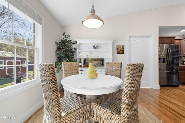 dining area with light hardwood / wood-style flooring