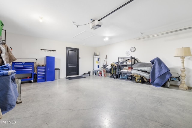 garage featuring a garage door opener and water heater