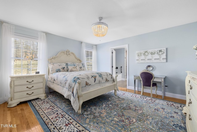 bedroom featuring wood-type flooring