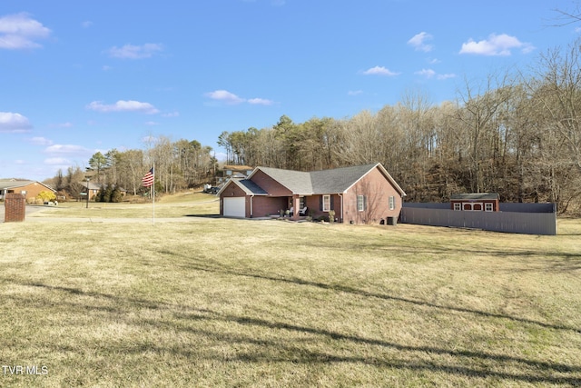 view of front of home featuring a garage and a front lawn