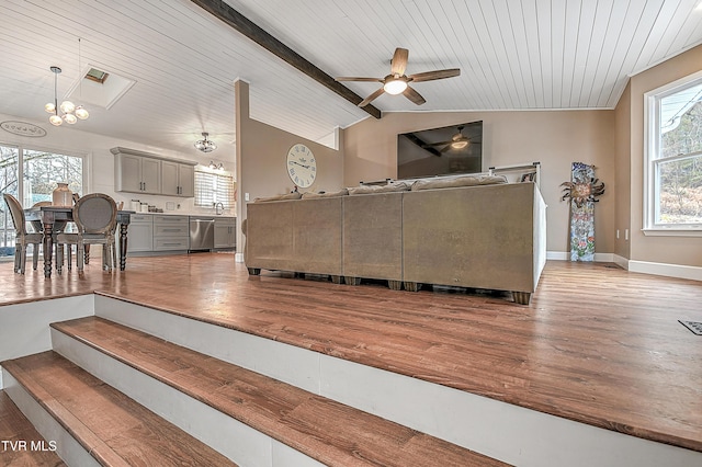 living room featuring lofted ceiling with beams, ceiling fan with notable chandelier, wooden ceiling, and light wood-type flooring