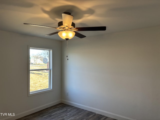 unfurnished room with dark hardwood / wood-style floors