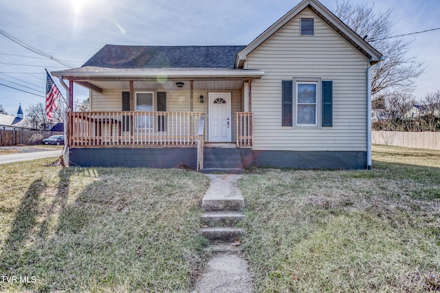 view of front of home with a front lawn and covered porch