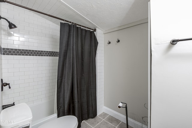 bathroom with tile patterned flooring, shower / bath combination with curtain, toilet, and a textured ceiling