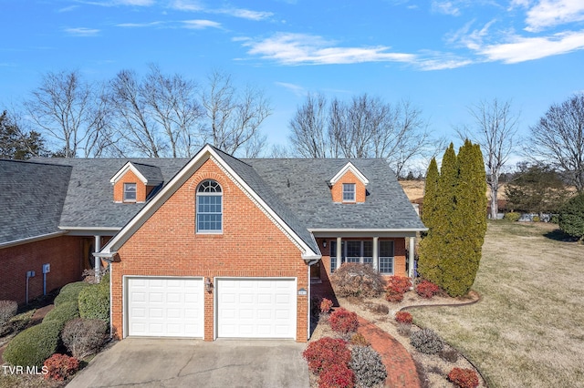 view of front of home with a garage and a front yard