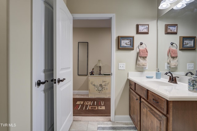 bathroom with vanity and tile patterned floors