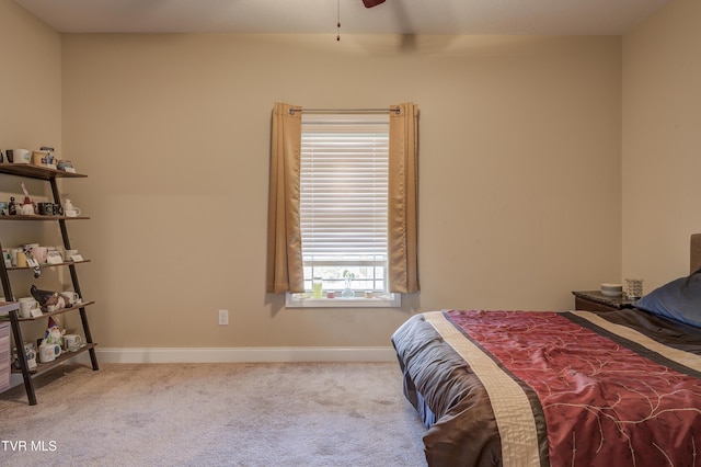 bedroom featuring light carpet