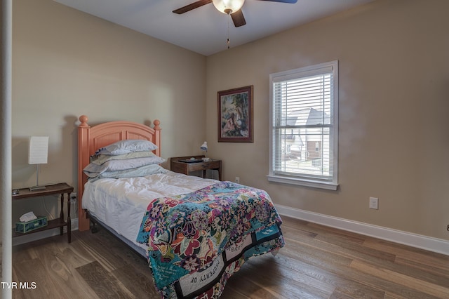 bedroom featuring hardwood / wood-style floors and ceiling fan