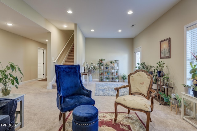 sitting room with light carpet and a healthy amount of sunlight