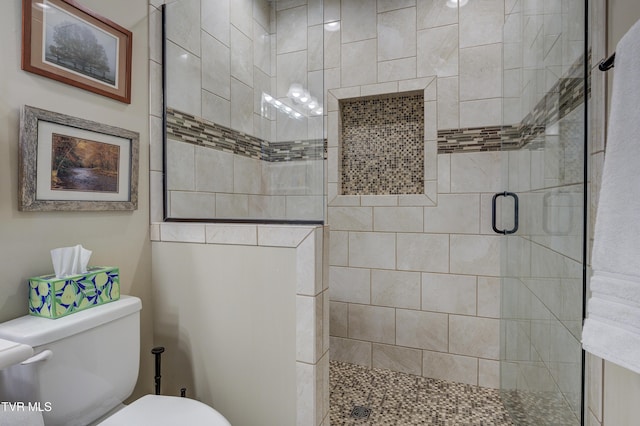 bathroom with walk in shower and toilet