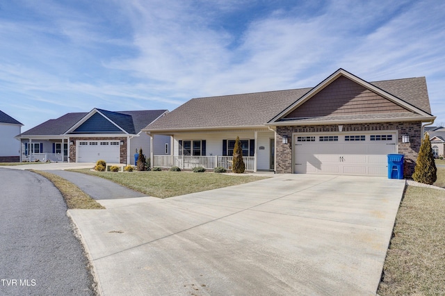 view of front of property with a garage and covered porch