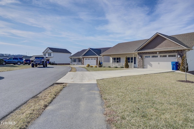 ranch-style home featuring a garage and a front lawn