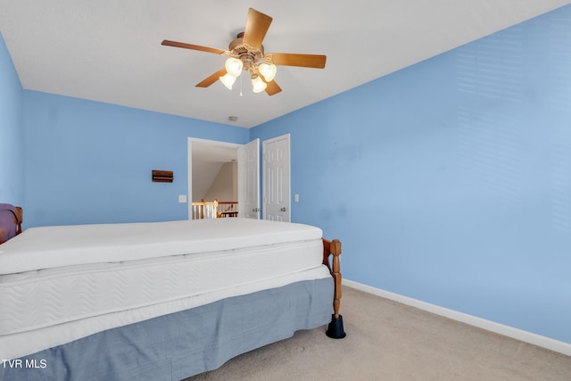 bedroom with light carpet and ceiling fan