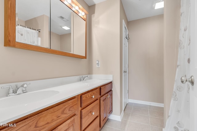 bathroom with vanity and tile patterned flooring