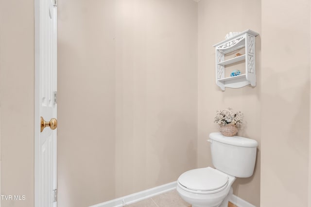 bathroom featuring tile patterned flooring and toilet