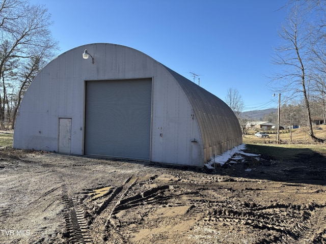 view of outdoor structure featuring a garage