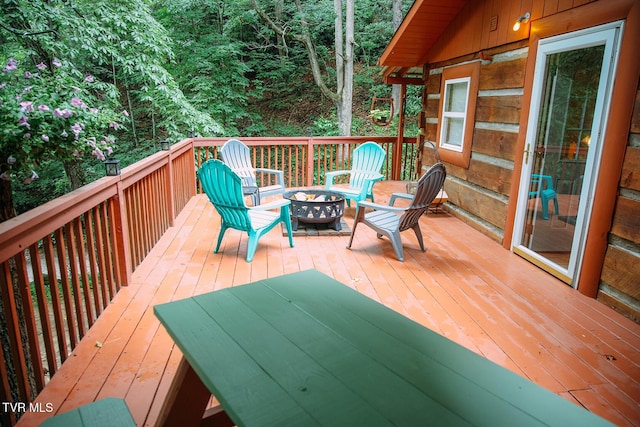 deck featuring a fire pit