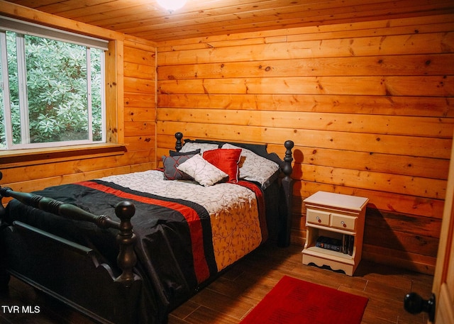 bedroom featuring dark hardwood / wood-style floors and wooden ceiling