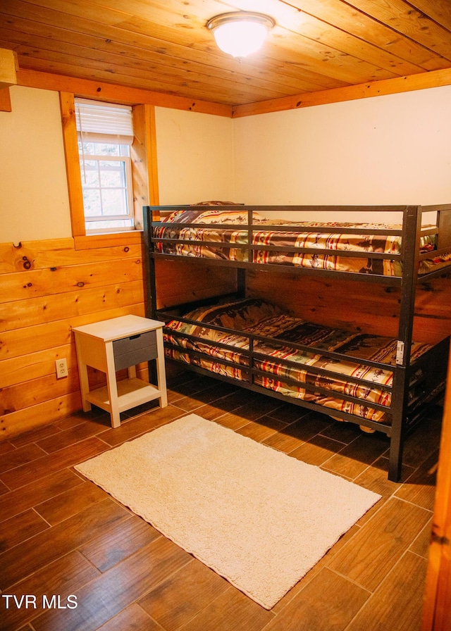 bedroom featuring wood ceiling, dark wood-type flooring, and wood walls