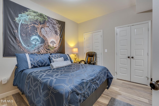 bedroom featuring wood finished floors and baseboards