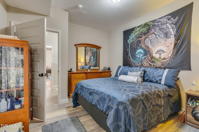 bedroom featuring wood finished floors