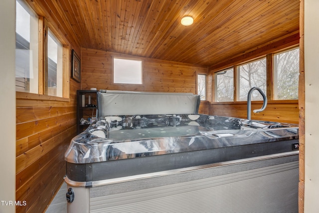 bedroom featuring wood walls and wood ceiling