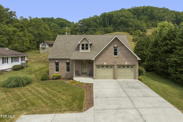 cape cod-style house with a garage and a front lawn