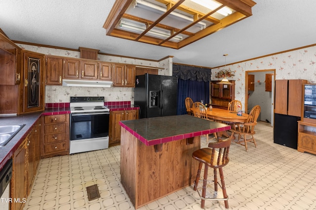 335 Clemon Rd, Whitesburg, TN 37891 - kitchen with white electric range, black refrigerator with ice dispenser, wallpapered walls, under cabinet range hood, and light floors