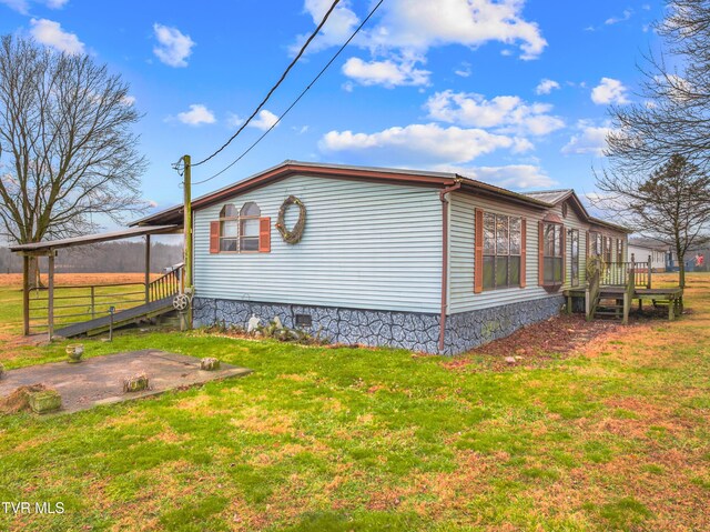 335 Clemon Rd, Whitesburg, TN 37891 - view of property exterior featuring a lawn and crawl space