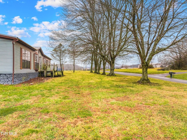 335 Clemon Rd, Whitesburg, TN 37891 - view of green lawn with a wooden deck