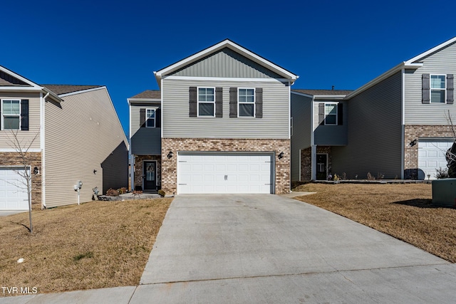 view of front of property featuring a garage and a front yard