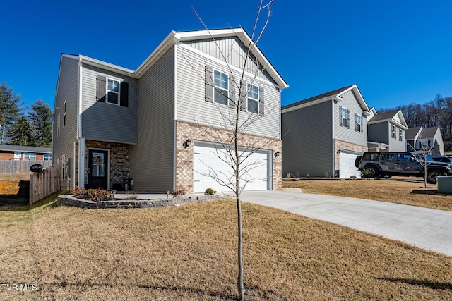 view of front of home featuring a garage and a front yard