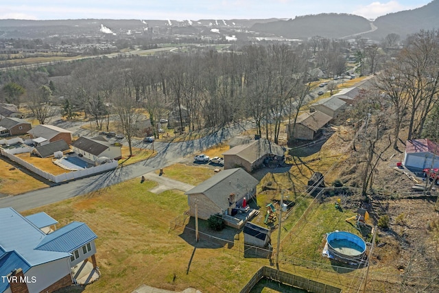 birds eye view of property with a mountain view