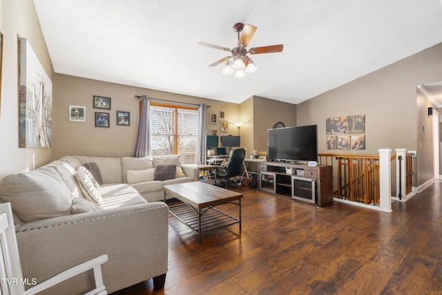 living room featuring lofted ceiling, dark wood-type flooring, a textured ceiling, and ceiling fan