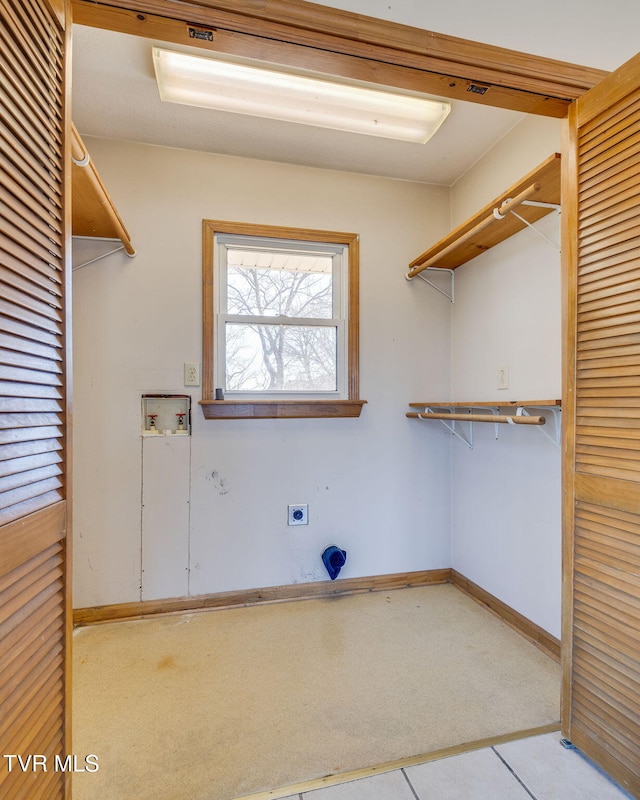 clothes washing area featuring washer hookup and hookup for an electric dryer