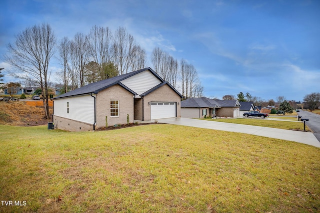 view of front of house featuring a garage and a front lawn