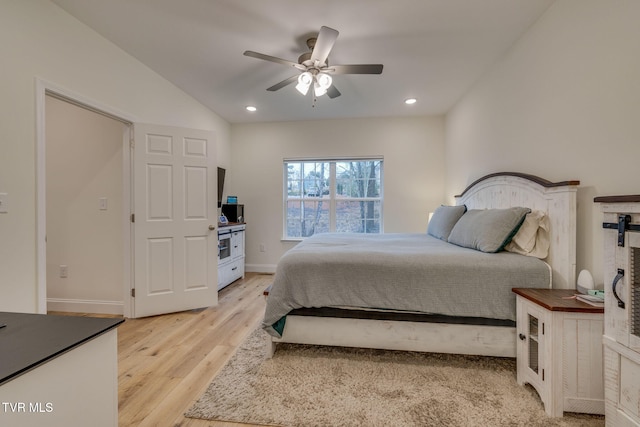 bedroom with ceiling fan and light hardwood / wood-style flooring