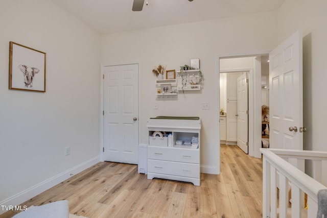 bedroom with light hardwood / wood-style flooring and ceiling fan