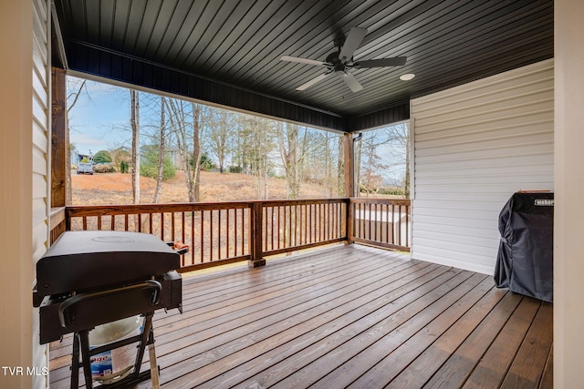 wooden deck featuring a grill and ceiling fan