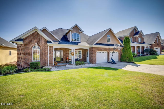 view of front of property featuring a garage, a front yard, and a porch