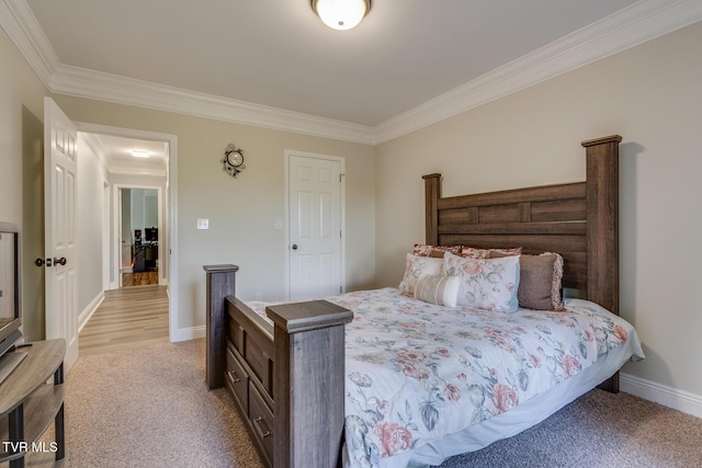 bedroom with crown molding and light carpet