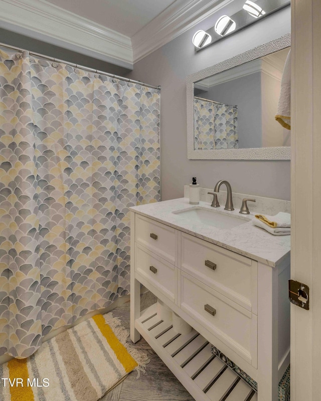 bathroom with vanity and crown molding