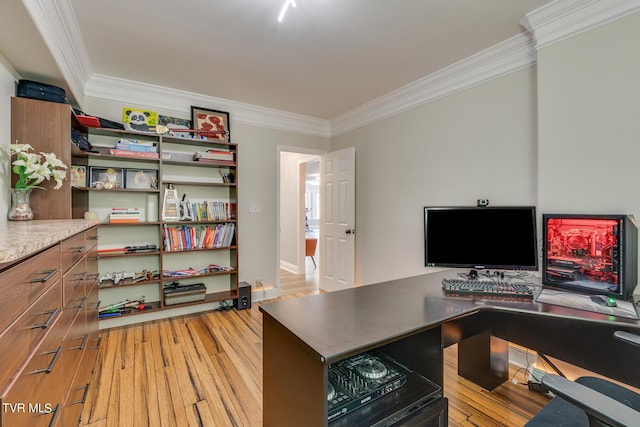 home office with crown molding and light hardwood / wood-style flooring