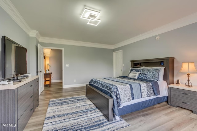 bedroom featuring ornamental molding and light wood-type flooring